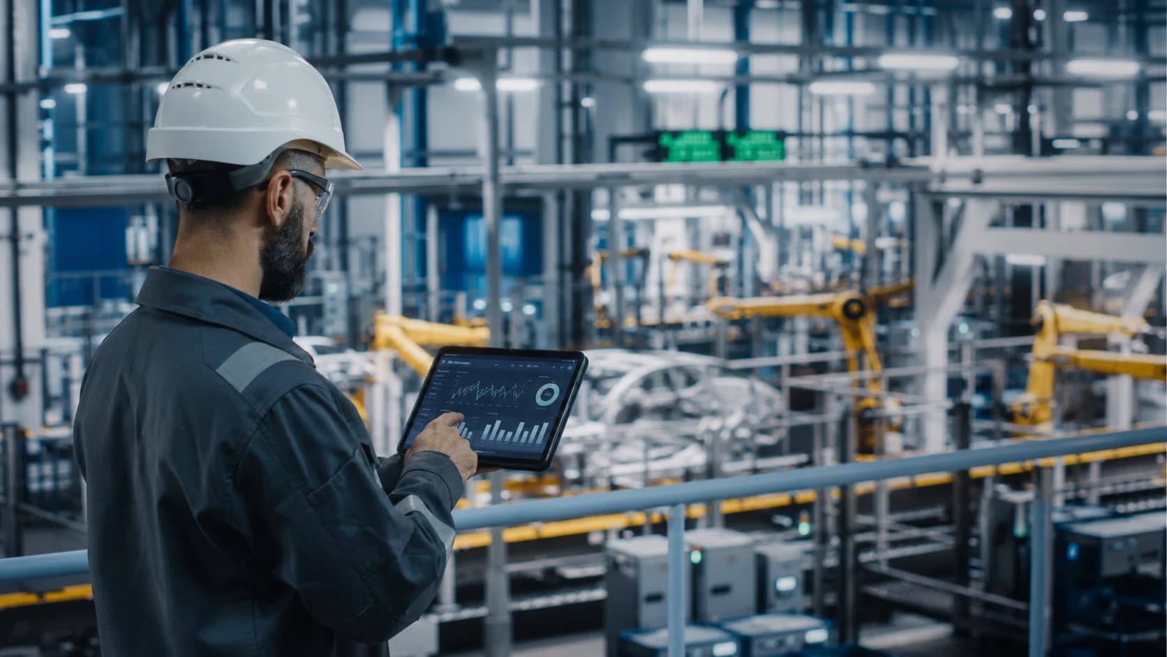Manufacturing industry research visual with engineer reviewing production analytics on a factory floor.